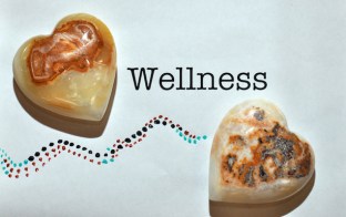 Two heart-shaped stone + wellness